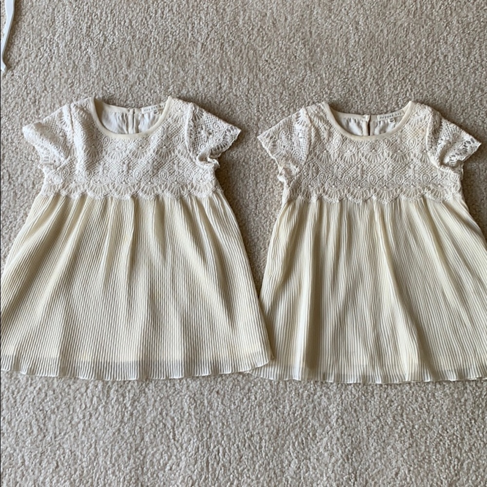 Twin girls matching embroidered and pleated dress